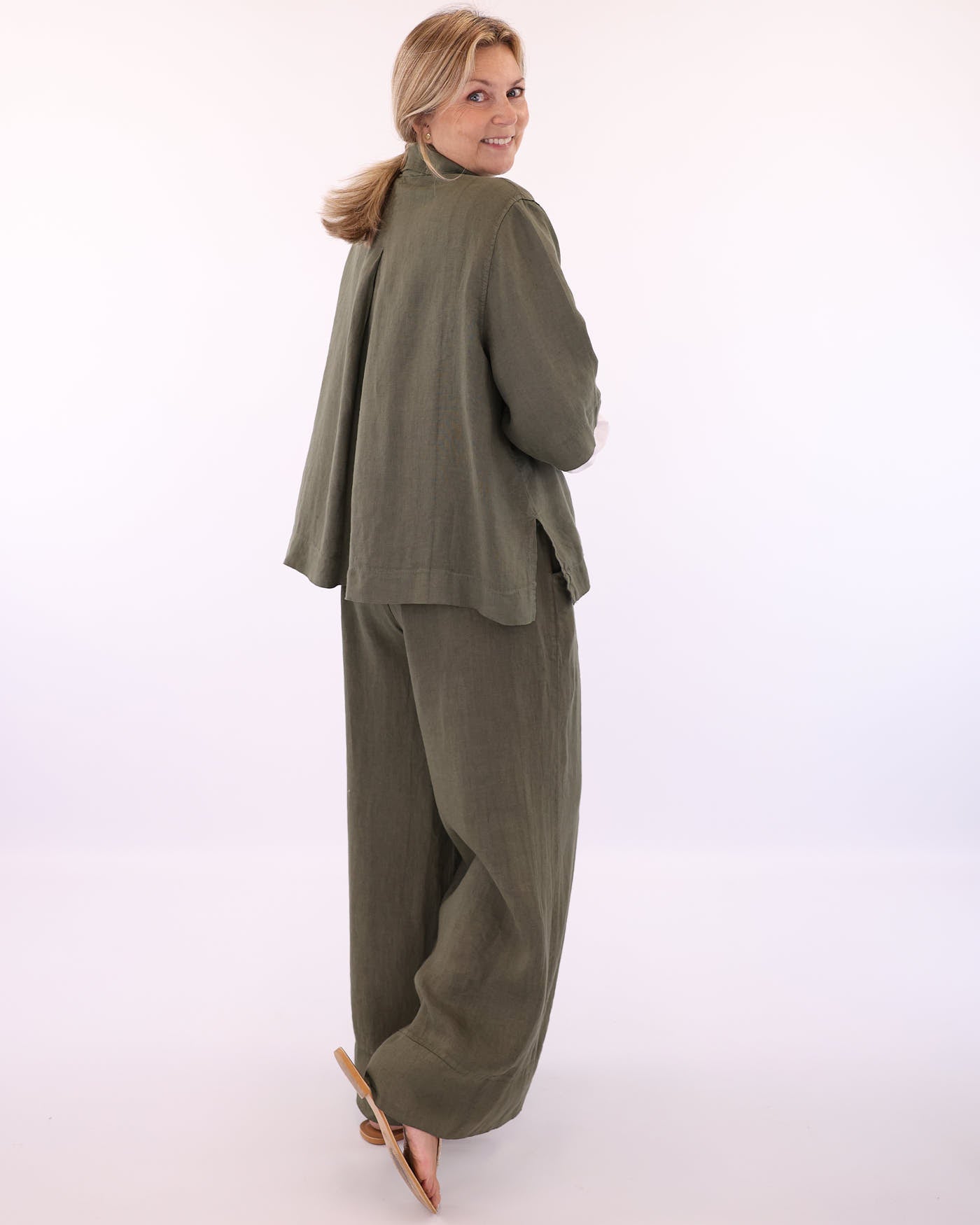 Women's Wide Leg Italian Linen Trousers in Olive Green with buttons at the waist and two front pockets