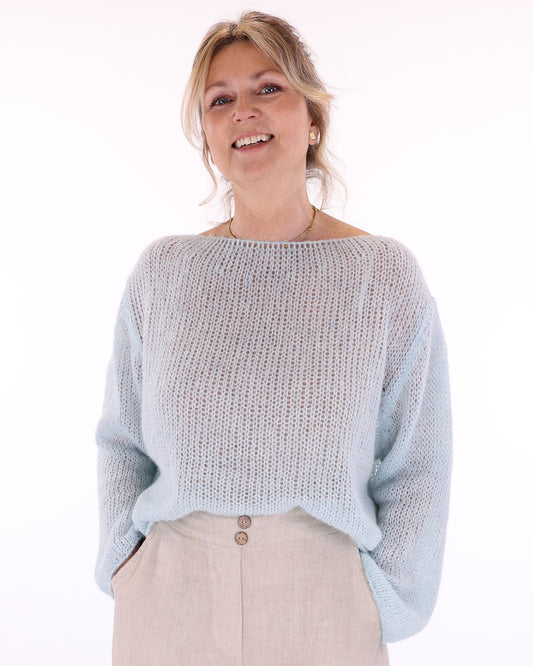 Women's long sleeve cobweb knitted alpaca blend sweater in pale blue, made in Italy