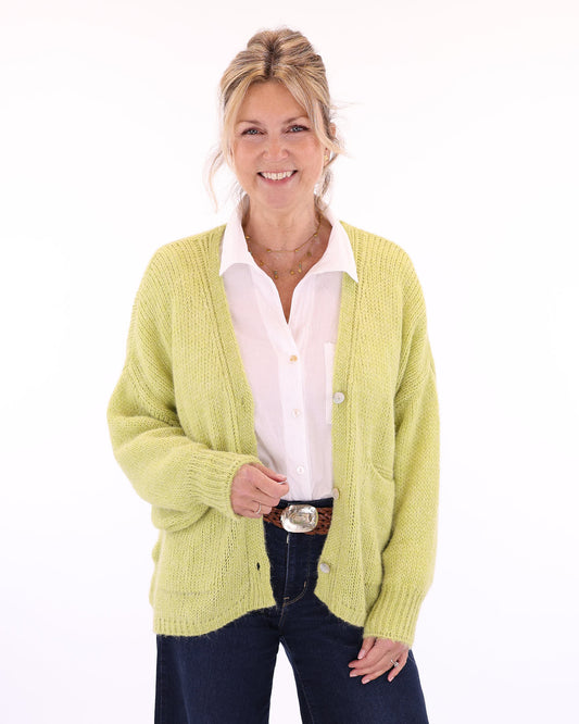 Women's long sleeve V neck alpaca blend knitted cardigan with front patch pockets and three buttons in light green, made in Italy
