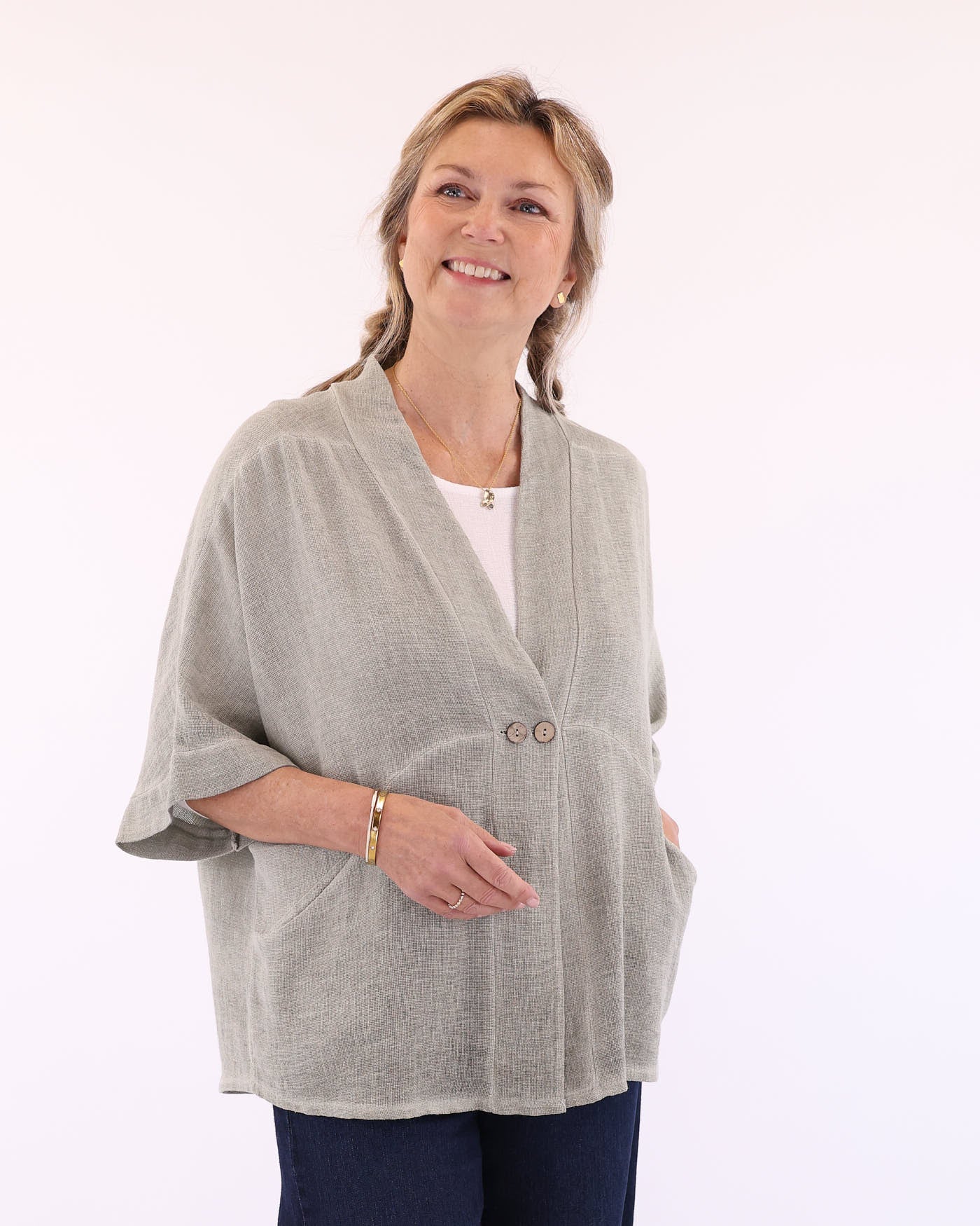 Women's Italian Kimono style linen and cotton blend jacket in sage green, with coconut buttons, elbow-length sleeves and front pockets