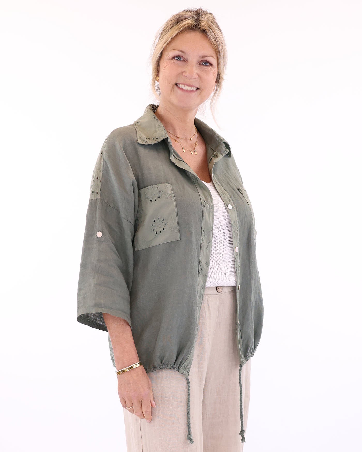 Women's button up shirt in sage green, with classic collar, drawstring hem, front chest pockets, made in a combination of pure linen and broderie anglais cotton,  made in Italy